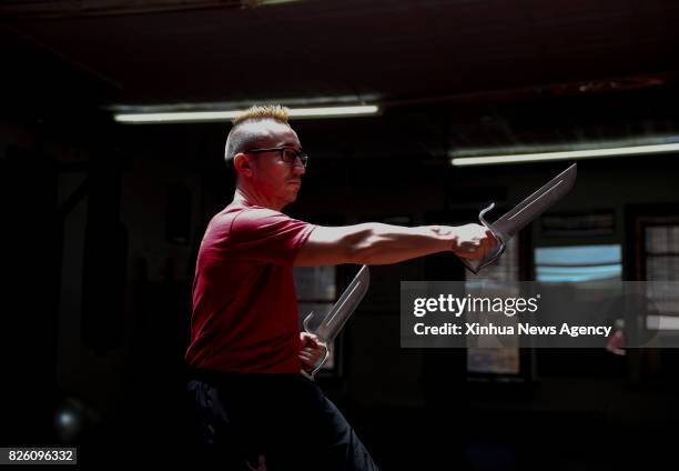 Aug. 3, 2017 : Alex Richter shows the Butterfly Swords Form in Wing Tsun at his Kung Fu school "City Wing Tsun" in New York, the United States, July...