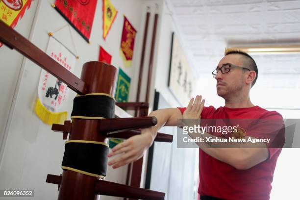 Aug. 3, 2017: Alex Richter practices with the Wooden Dummy at his Kung Fu school "City Wing Tsun" in New York, the United States, July 17, 2017....