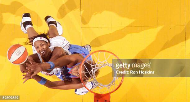Tammy Sutton-Brown of the Indiana Fever battles Erika de Souza of the Atlanta Dream at Conseco Fieldhouse on August 30, 2008 in Indianapolis,...