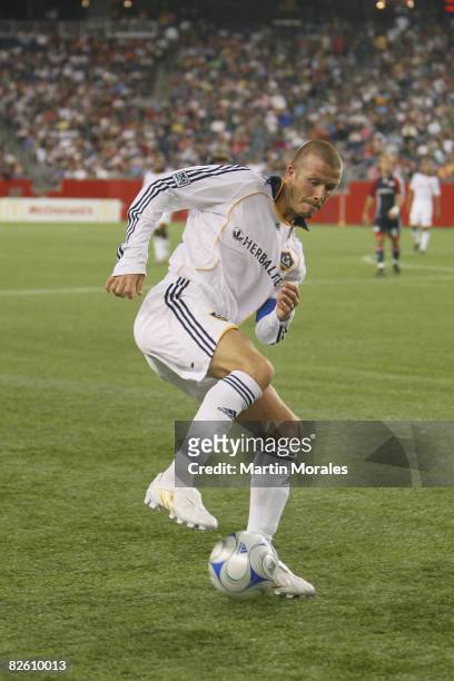 David Beckham of the Los Angeles Galaxy handles the ball during the game played against the New England Revolution at Gillette Stadium on August 30,...
