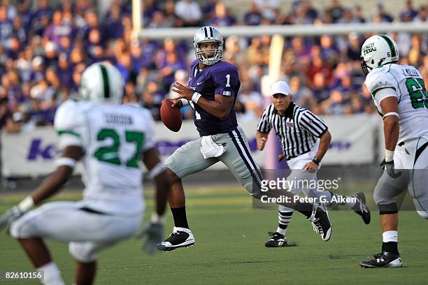 Quarterback Josh Freeman of the Kansas State Wildcats scrambles to the outside against pressure from the North Texas Mean Green defensive in the...