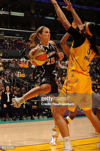 Candace Parker of the Los Angeles Sparks attempts to block a pass from Becky Hammon of the San Antonio Stars during the game at Staples Center on...