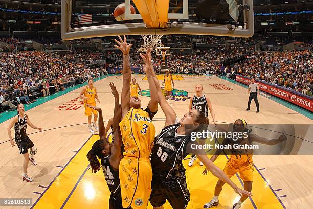 Candace Parker of the Los Angeles Sparks blocks a shot from Ruth Riley of the San Antonio Stars as during the game on August 30, 2008 at Staples...