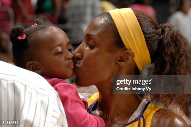 Lisa Leslie of the Los Angeles Sparks kisses daughter, Lauren following her team's victory over the San Antonio Stars on August 30, 2008 at Staples...