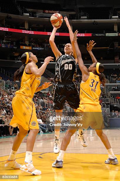 Ruth Riley of the San Antonio Silver Stars shoots between Candace Parker and Jessica Moore of the Los Angeles Sparks on August 30, 2008 at Staples...