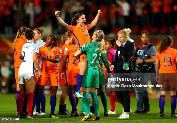 Danielle van de Donk of The Netherlands celebrates with team mate Loes Geurts after winning the UEFA Women's Euro 2017 Semi Final match between...