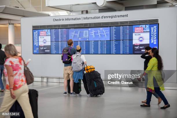 people at pearson international airport - arrival time stock pictures, royalty-free photos & images