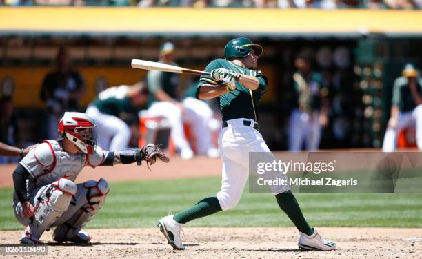 Jaycob Brugman of the Oakland Athletics bats during the game against the Cleveland Indians at the Oakland Alameda Coliseum on July 16, 2017 in...