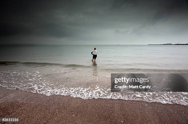 Woman paddles in the sea at Weymouth seafront on August 31 2008 in Weymouth, England. Forecasters have claimed that this August has been one of the...