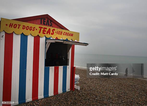 People wall past a food hut at Weymouth seafront on August 31 2008 in Weymouth, England. Forecasters have claimed that this August has been one of...