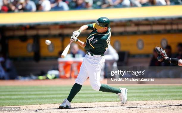 Jaycob Brugman of the Oakland Athletics bats during the game against the Cleveland Indians at the Oakland Alameda Coliseum on July 16, 2017 in...