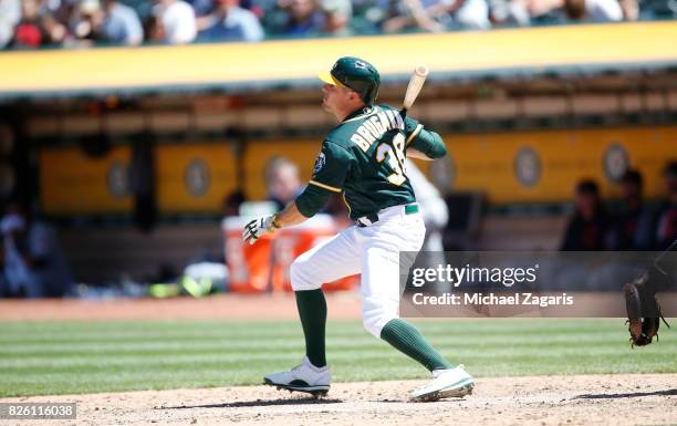 Jaycob Brugman of the Oakland Athletics bats during the game against the Cleveland Indians at the Oakland Alameda Coliseum on July 16, 2017 in...