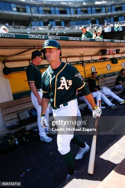 Jaycob Brugman of the Oakland Athletics stands in the dugout during the game against the Cleveland Indians at the Oakland Alameda Coliseum on July...