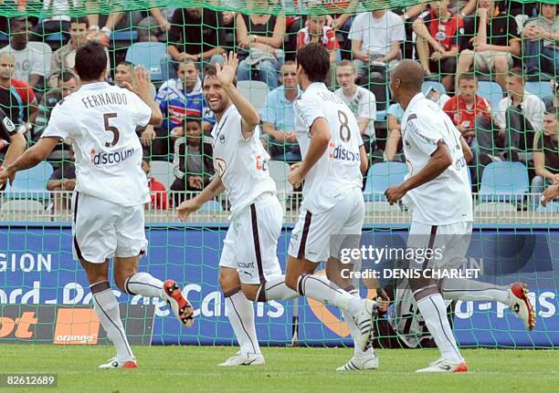 Bordeaux' Argentinian forward Cavenaghi Fernando is congratuled by his teammates after scoring a goal during the French L1 football match Lille vs....