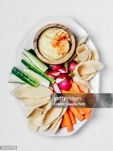 hummus with vegetables and tortilla chips - crudite stock pictures, royalty-free photos & images