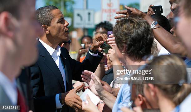 Democratic Presidential Candidate Illinois Senator Barack Obama greets well-wishers after attending church services at St. Luke's Lutheran Church in...