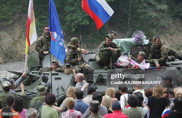 North Ossetian people welcome Russian soldiers as they leave South Ossetia at the North-South Ossetia border some 60 km outside Vladikavkaz on August...