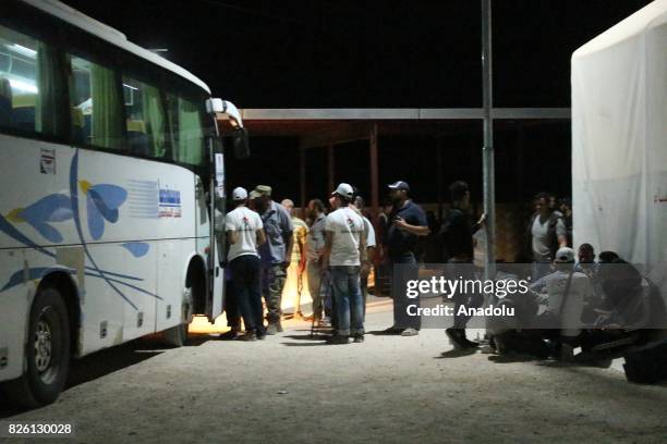 Syrian refugees return their homes with a bus after Ahrar al-Sham and Hezbollah announced a cease-fire, in Idlib, Syria on August 03, 2017. First...