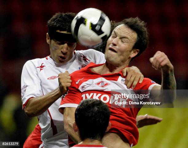 Martin Jiranek of FC Spartak Moscow fights for the ball with Aleksandr Amisulashvili of PFC Spartak Nalchik during the Russian Football League...