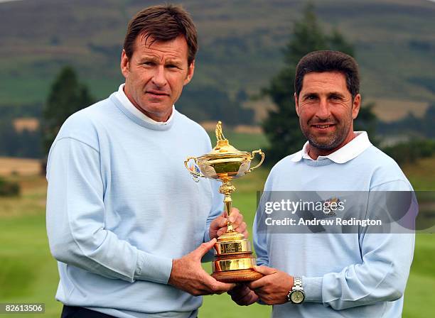 Nick Faldo of England and Jose Maria Olazabal of Spain pose with the Ryder Cup trophy after the Ryder Cup Press Conference after the final round of...
