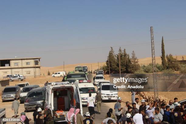 First group of Syrian refugees arrive, after a cease-fire announced between Hezbollah and Ahrar al-Sham, in Idlib, Syria on August 03, 2017. Convoy...