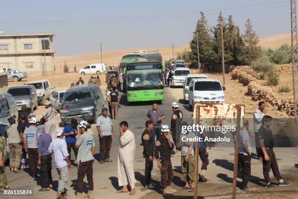 First group of Syrian refugees arrive, after a cease-fire announced between Hezbollah and Ahrar al-Sham, in Idlib, Syria on August 03, 2017. Convoy...