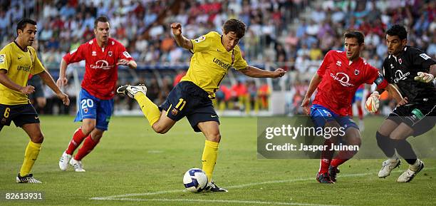 Bojan Krkic of Barcelona kicks the ball in between Xavier Hernandez of Barcelona and Alvaro Anton Domingo Nagore and goalkeeper Juan Pablo Colinas of...