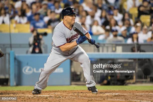Bartolo Colon of the Minnesota Twins bunts against the Los Angeles Dodgers on July 24, 2017 at Dodger Stadium in Los Angeles, California The Dodgers...