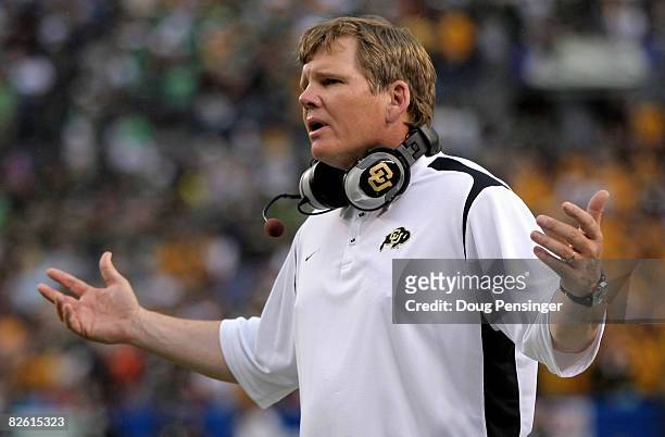 Head coach Dan Hawkins of the University of Colorado Buffaloes protests a call to the officials against the Colorado State University Rams at Invesco...