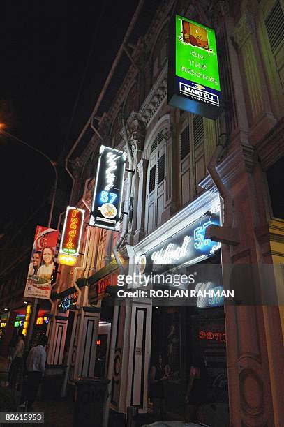 Singapore-Philippines-prostitution-women-trafficking,FEATURE by Martin Abbugao This photo taken on August 27, 2008 shows rows of pubs and bars along...