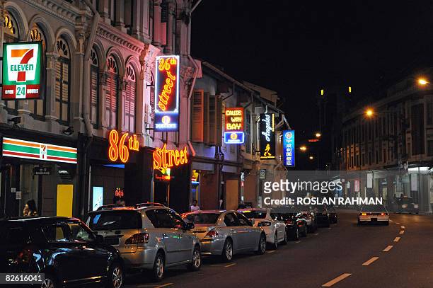 Singapore-Philippines-prostitution-women-trafficking,FEATURE by Martin Abbugao This photo taken on August 27, 2008 shows rows of pubs and bars along...