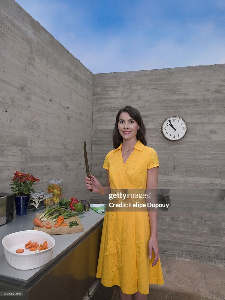 Woman in makeshift kitchen of unfinished house