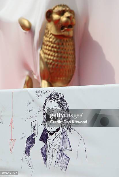 Drawing of Heath Ledger starring the Joker in his last movie 'Batman - The Dark Knight' is seen near the red carpet during the 65th Venice Film...