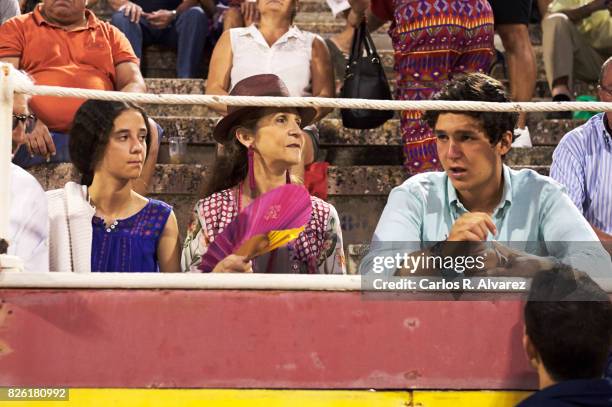 Princess Elena of Spain and her sons Felipe Juan Froilan de Marichalar y Borbon and Victoria Federica de Marichalar y Borbon attend the Bullfights at...