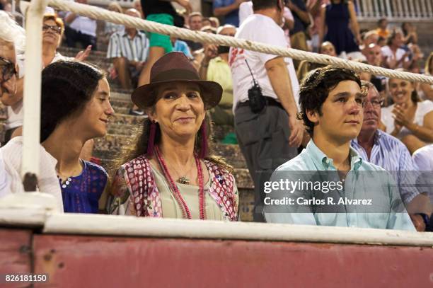 Princess Elena of Spain and her children Felipe Juan Froilan de Marichalar y Borbon and Victoria Federica de Marichalar y Borbon attend the...