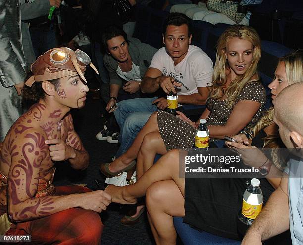 The Beatles Love cast member Hassan El Hajjami , speaks with singer Britney Spears and guests at The Beatles Love by Cirque du Soleil at the Mirage...