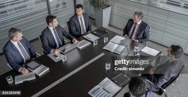 five directors and ceo in meeting - only men boardroom stock pictures, royalty-free photos & images