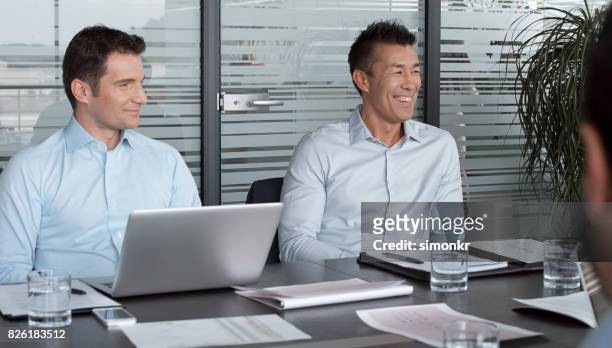 businessmen in meeting - powder blue shirt stock pictures, royalty-free photos & images