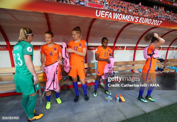 Loes Geurts, Mandy Van Den Berg, Kelly Zeeman and Lineth Beerensteyn of Netherlands Women get ready as they sit on the bench before the UEFA Women's...