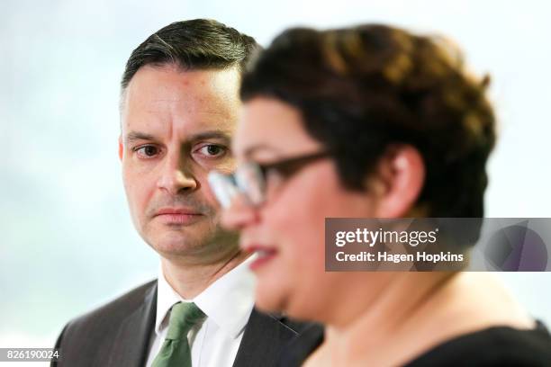 James Shaw looks on while Metiria Turei speaks during a press conference on August 4, 2017 in Wellington, New Zealand. The Green Party co-leader came...