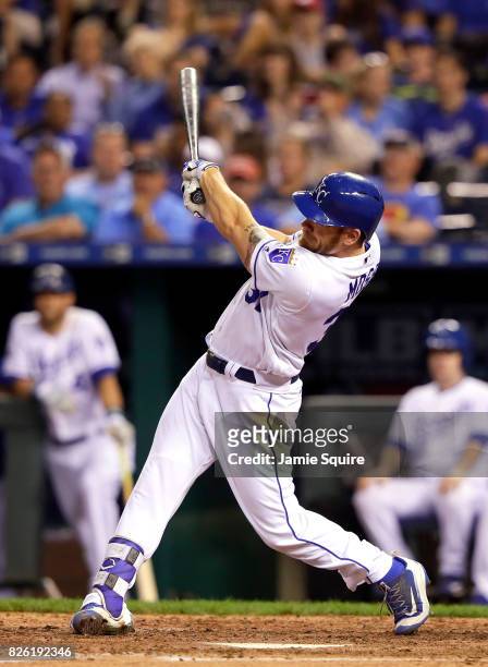 Brandon Moss of the Kansas City Royals hits a two-run home run during the 5th inning of the game against the Seattle Mariners at Kauffman Stadium on...