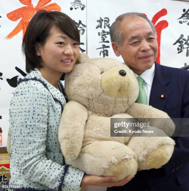 File photo taken in December 2014 shows House of Representatives lawmaker Takako Suzuki and her father Muneo, a former lower house lawmaker, in...