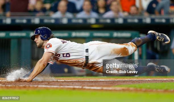 Jake Marisnick of the Houston Astros scores in the fifth inning on a single by Alex Bregman against the Tampa Bay Rays at Minute Maid Park on August...