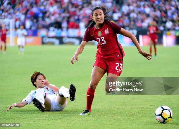 Christen Press of the United States chases after a ball in front of Yuka Momiki of Japan during the first half of the 2017 Tournament Of Nations at...