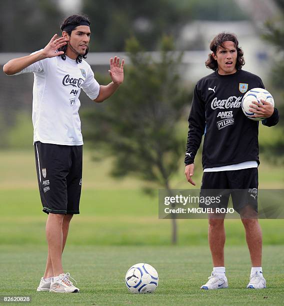 Uruguayan footballer Sebastian Abreu gestures next to teammate Alvaro Gonzalez during a training session on September 01, 2008 in Montevideo. Uruguay...