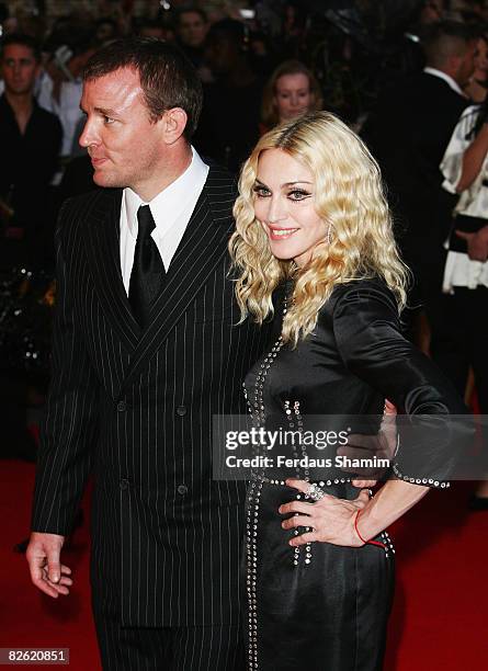 Director Guy Ritchie and Madonna attend the World Premiere of "RocknRolla" held at the Odeon West End, Leicester Square on September 1, 2008 in...