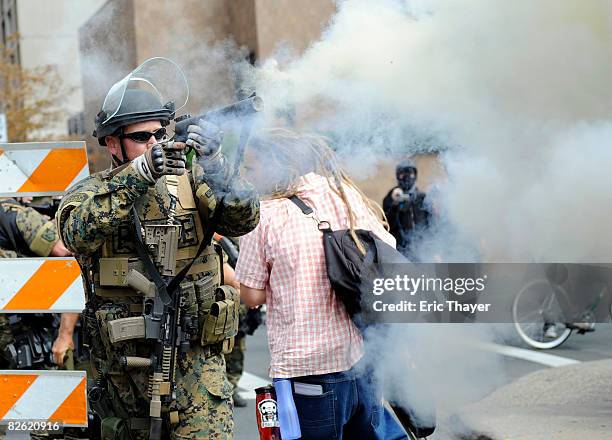 Police fire tear gas as protesters attempt to disrupt the 2008 Republican National Convention near the site at the Xcel Energy Center September 1,...