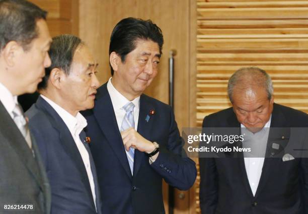 Japanese Prime Minister Shinzo Abe is shown in his office in Tokyo before a Cabinet meeting in the photo taken on Aug. 4 a day after he reshuffled...