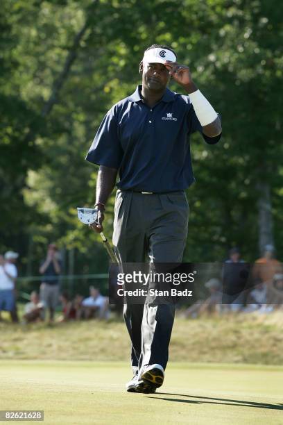 Vijay Singh tips his brim after making his putt at the 13th green during the final round of the Deutsche Bank Championship held at TPC Boston on...