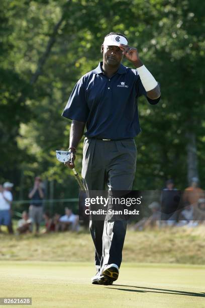 Vijay Singh tips his brim after making his putt at the 13th green during the final round of the Deutsche Bank Championship held at TPC Boston on...